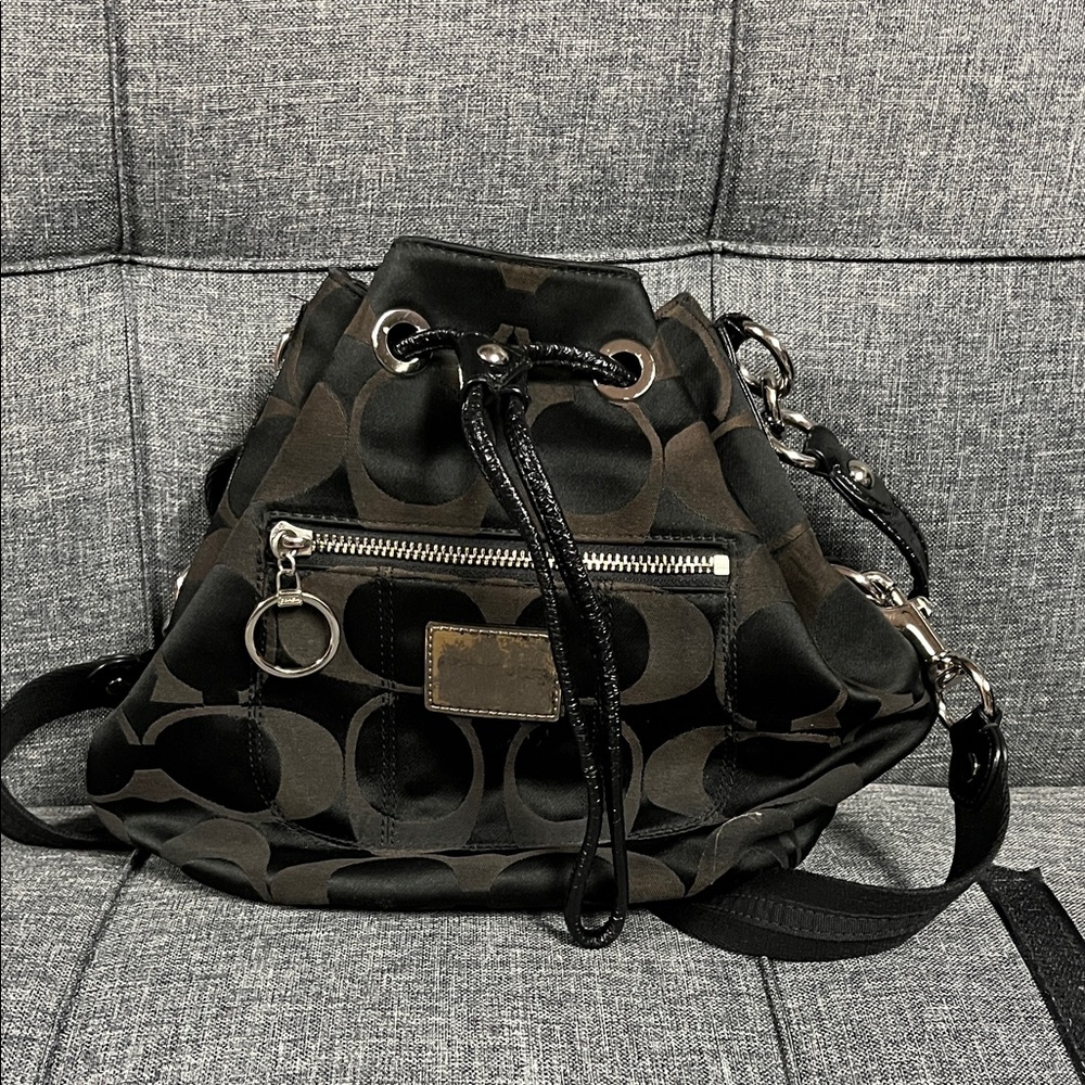 Black Coach “Poppy” signature sateen drawstring crossbody bag